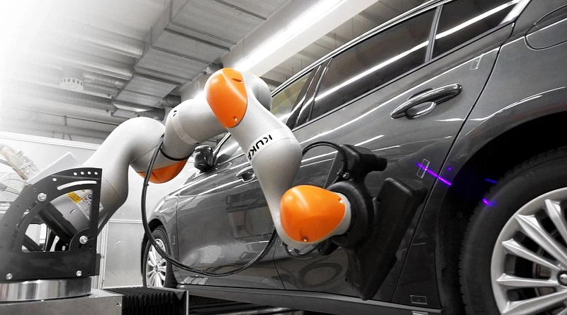 KUKA assembly robot in motion KUKA assembly robot in motion