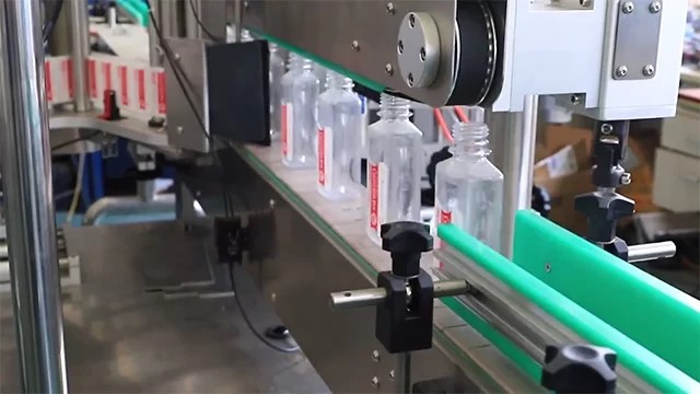 Máy dán nhãn chai vuông Máy dán nhãn chai vuông