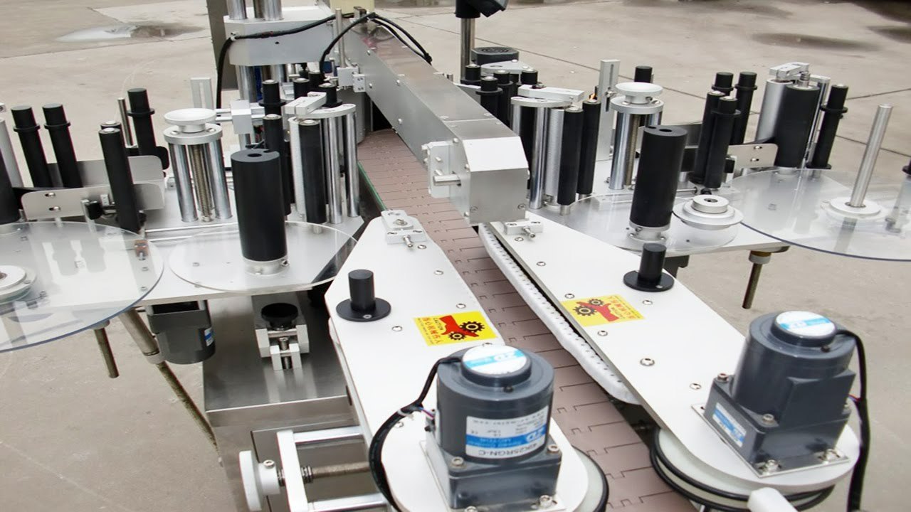 Máy dán nhãn hai mặt quay Máy dán nhãn hai mặt quay